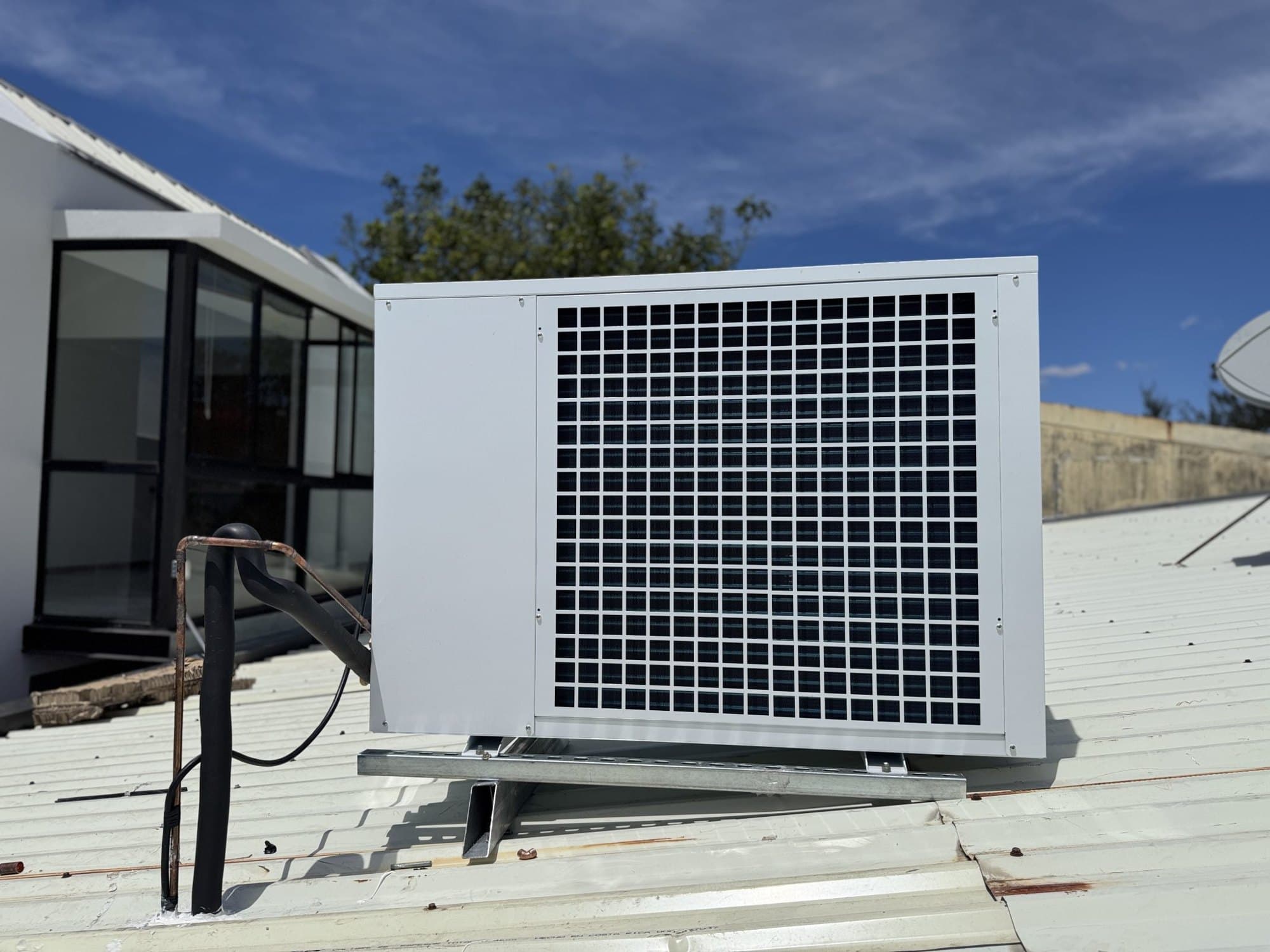 Rooftop air conditioning unit under a clear sky