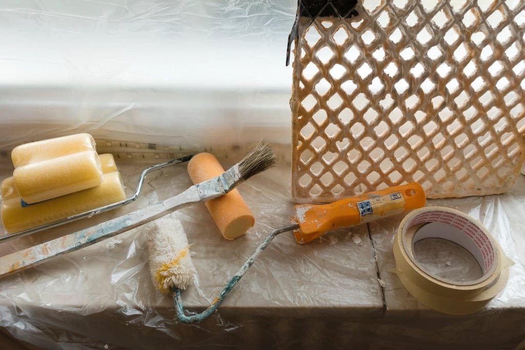 Painting tools and masking tape prepared for a home renovation